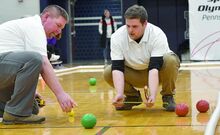  Judges Nick Karnes, left, and Al Sarnoski uses a measuring tape to determine the points for the first match against the two Danville teams during Tuesday afternoon’s Interscholastic Unified Sports Bocce League Championships at Central Columbia. 