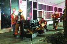 Press Enterprise/Keith Haupt Firefighters removed a charred wooden bench from a newly leased storefront Wednesday morning in Bloomsburg. Shown are, from left, Bloomsburg Fire Chief Scott McBride, East End Mahoning Township Chief Leslie Young and Bloomsburg Deputy Chief John Mahon.