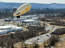 Bloomsburg Chevrolet’s advertising blimp stays stationary for a moment, with its line tangled in a tree. Moments later the blimp's tether would let loose of the tree and the blimp would float north. It was later recovered.