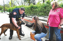 Commonwealth University-Bloomsburg staff passing by the university police station stop to meet the the new K9 dog, a one-year-old Belgian Malinois named Rush, on Wednesday. From left are police officer and handler Eli Middaugh, Emily Wolfe and Michelle Leiby. 