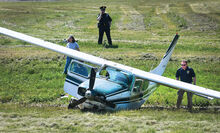 Police, fire and airport officials arrive at an airplane crash on the west end of the Bloomsburg airport runway Wednesday morning.