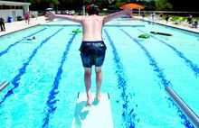 James Hnylanski, 13, Bloomsburg, dives into the Norris E. Rock Memorial Pool in Bloomsburg Saturday afternoon. The teen was the first member of the public to get in the water. The dive shown was his third.