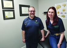 Dr. John Showalter and his wife Grace Showalter BSRN are in an examination room at their new business Mindful Integrative Medicine located at 1238 Bloom Road in Mahoning Township.