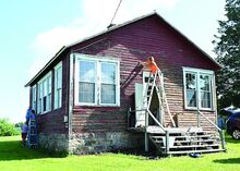 The Hess family and Robinson family are working on the preservation of the Turnpike School located next to Mount Zion Church on Church Road in Nescopeck Saturday morning, they are scraping off the old paint on the exterior of the building and are going to repaint it. 