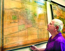 Dave Millard looks over an 1870 map of Bloomsburg at the Columbia County Historical and Genealogical Society’s new museum on Market Square in Bloomsburg. Millard, a former State Representative, now serves as president of the society, which wants to digitize the early minutes of Bloomsburg's town council. 