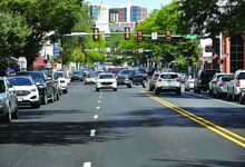 The right lanes closest to parked vehicles on Main Street in Bloomsburg have been repainted to be narrower than the left travel lanes.