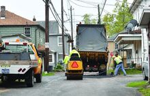 A crew from Bloomsburg Public Works work to fill a large pothole on West Pine Ave. near Blackberry Ave. Wednesday afternoon. 