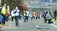 Runners in the Boys 3-6 group head toward the finish line led by Landon Zapata, race winner from Berwick, during Saturday morning's 64th Annual CW Heller Memorial Races in Berwick