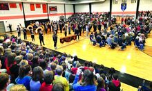 The Benton High School Band plays to open the Benton Area School District’s annual Veterans Day program in the gym at L.R.Appleman Elementary School on Monday morning. The school district has been holding the Veterans Day program for students and community members since at least the early 1990s. 