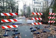 Barriers are in place, on Tuesday, to close a Yost Hollow Road bridge over the West Branch of Briar Creek in Briar Creek Township.