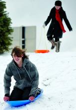 Jacob Hook, 15, sleds down a hill behind Salem Elementary School