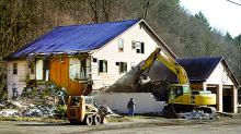 A crew demolishes the former HRI building off Route 42