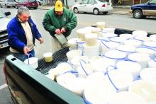 Lions Club member Larry Kahle sells some of the club's sauerkraut to Catawissa resident Joseph Fowler 