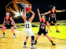 Benton’s Casey Gavin guards Southern’s Kayla Lavella as Lavella looks for a teammate