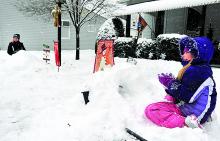 Kylie Kingston preps a pile of snowballs in preparation for a throwing fight