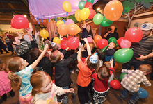 Kids celebrate as the clock struck noon and balloon fell from the rafters during the Bloomsburg Children’s Museum Countdown to Noon Friday in Bloomsburg. There was also a DJ, Elsa, Spiderman and themed crafts and games. 