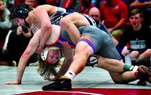 Central Columbia’s Greyson Shaud controls Danville’s Aaron Johnson in their 172-pound quarter-final match during DKI wrestling at Bloomsburg High School on Saturday.  Shaud won by fall. 