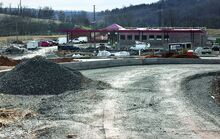 Work continues on the new Sheetz convenience store and truck stop being constructed in Buckhorn Wednesday. In the foreground is the new Wedgetown Road, which will be relocated through the new development area to the traffic light at Route 42. 