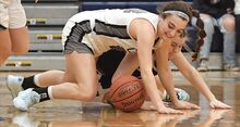 Central Columbia's Madelyn Blake, foreground, draws the foul from Shamokin’s Anastasia Wetzel while going for the loose ball during the first quarter of Friday night’s game at Central. The Blue Jays rolled to a 46-15 win.