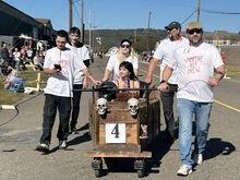 The Bit Crew team pushes their coffin back to the waiting area after finishing a heat in the Berwick Coffin Races Saturday. Coffin pushers, from left, are Angelo Laffredo, Daniel Spotts, Diane Spotts, Michael Spotts and Wade Whitmoyer. Riding is Alison Spotts.