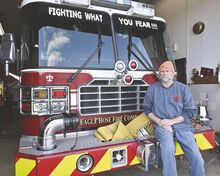 Eagle Hose Fire Company Chief Randy Remphrey sits on the front bumper of the company’s engine last week at the station in Berwick. The Berwick Fireman's Relief Association recently reclaimed much of the gear that it had assigned to the company.