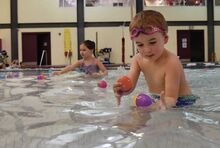 Archie McConaghy, 4, in foreground, and Leni-Mae Sellers, 5, collect eggs floating on the pool water during an aquatic egg hunt Wednesday evening at the Berwick YMCA. Students in 12 sessions over three days will get the chance to collect Easter eggs that either float or sink to the bottom of the pool.