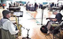 Saxophonist Bob Messbauer, left, Brodsville, and guitarist Steve Tyree, Stillwater, play for those gathered for the Northern Columbia Community and Cultural Center’s community lunch in Benton on Sunday afternoon. About 120 people attended the event to kickoff the nonprofit’s annual fundraising campaign.