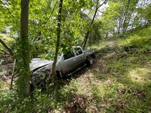 A truck plummeted down a steep embankment off Interstate 80 on Tuesday near Hetlerville Road. (Press Enterprise/Jimmy May)