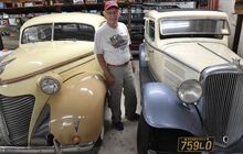 Larry Creasy stands between his 1938, left, and 1933 Hudsons on display in Creasy’s Garage in Espy on Friday, at left. Creasy is the third owner of the 1933 vehicle, which has spent its whole life in Espy and also has the original interior.