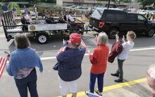 Members of the Shickshinny American Legion Post, above, ride along Main Street in a Memorial Day parade on Monday..