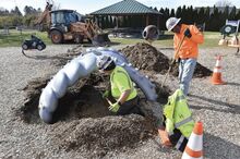 Salem Township's Department of Public Works employees Chris Remphrey, left, and Ed Fenton, foreman, secure the final piece of equipment in the new sensory playground. It’s behind the township building at 38 Bomboy Lane.