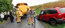 Emergency personnel and Danville Area School District officials gather where a school bus and minivan crashed Wednesday afternoon in Derry Township.