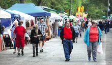 Visitors walk down the midway at the 21st annual Riverfest in Berwick on Friday afternoon.