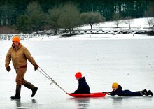 Andrew Makuch, Danville, in photo above, pulls his sons across Lake Chillisquaque at Montour Preserve, near Washingtonville, on Sunday afternoon. That’s Weston, 8, sitting on the sled. Hunter, 5, slides merrily along behind.