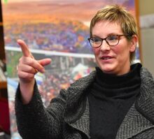 Danville Business Alliance Director Rebecca Dressler gestures during an interview at her office along Mill Street recently. Dressler was diagnosed with an aggressive form of breast cancer last February.