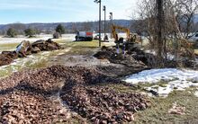 Heavy equipment works on the small stream crossing the former Wolf Hollow golf property. Bloomsburg Carpet Industries now owns the land.