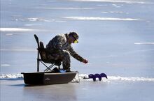 Noah Weidner, North Centre Township, tries his hand at ice fi shing on Briar Creek Lake on Sunday. He said he still has lots to learn about the cold-weather sport. “I’ll keep trying, something will happen,” he added.