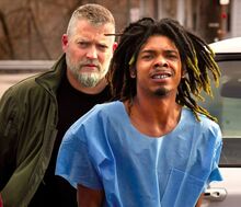 Isaiah Newton, 26, Berwick, is escorted into district court by Berwick Police Det. Greg Martin on Saturday afternoon. Newton is charged with killing Frederick James McConnell, 28, also of Berwick.