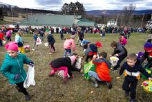 Kids scramble to collect plastic eggs and prizes during the fifth annual Easter egg hunt on the grounds of the Unityville Fire Company on Sunday afternoon. Fire company officers and event co-chairs Lisa Robbins and Rachel Gordner estimated more than 200 children were on hand to collect more than 8,000 eggs. All prizes and eggs were donations from the community.