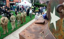 Veterans groups and war re-enactors line the lawn of the Stuart Tank Memorial Museum during Saturday morning’s opening ceremony. The photo is taken from and shows part of Lady Lois, one of the more than 15,000 tanks produced by AC&F in Berwick before the plant closed in 1944.