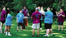 Camp Courage Participants, from left, staffer Kristen Pelzer; campers Keyonna James, 13, Berwick, and Brock Kachurka, 12, Lime Ridge; staffers Cody Dietterick and Filiberto Martinez; campers Jazelle Whitchsett, 12, Bloomsburg, and her brother, Kayden Whitchsett, 13; and staffer Jen Morris make a group identity web with yarn at Water’s Edge in Eyers Grove on Saturday.