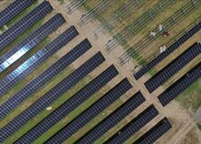 A crew started mounting solar panels to the frames, above, installed near the Central Columbia Administration building Thursday. There will be 5,818 solar panels covering the ground along with 892 panels on the high school roof and 262 panels on the administration building. The nearly 7,000 panels will be a 3.76 MW system when completed.