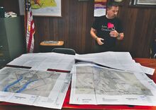 Supervisor Mike Kull reviews plans of a proposed solar panel project in Valley Township.