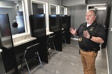 Montour County Warden Sam Kranzel stands on the second floor of the newly renovated Montour County Jail. There are six stations where inmates can talk to visitors by phone and see them.