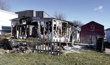 The remains of Sheila Kressler’s trailer, top photo, at 522 Montour Blvd., Lot 2, in Montour Township, are seen late Sunday morning. The fire struck the home just off Route 11.