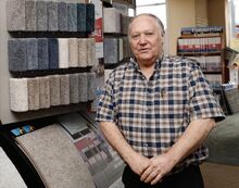 Kirk Bower stands inside Kissinger’s Floor and Wall in Berwick. Bower says scammers contacted him pretending to be PPL.