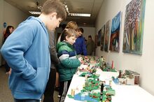 Desmond Oberdorf and Matthew Raski look at different Lego creations on Tuesday at The Exchange in Bloomsburg.