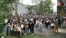 Party goers fill Fetterman Avenue during Saturday's Block Party. Rain subdued the gathering this year.