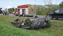  Police said a Chevrolet Impala, at left, went out of control and crashed in a grassy median off the westbound lanes at about 11:50 a.m. Westbound traffic was stalled before the crash was cleared about two hours later, according to the emergency dispatch center.